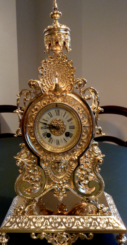 gilded antique clock after restoration